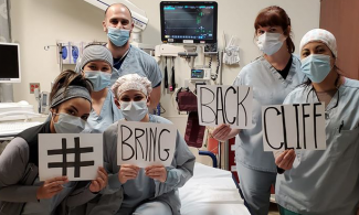 Healthcare workers holding signs that read #BringBackCliff